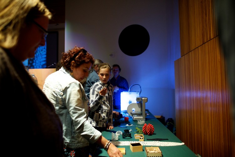 Workshop participants examining our sample parts, photo by Ash Adams